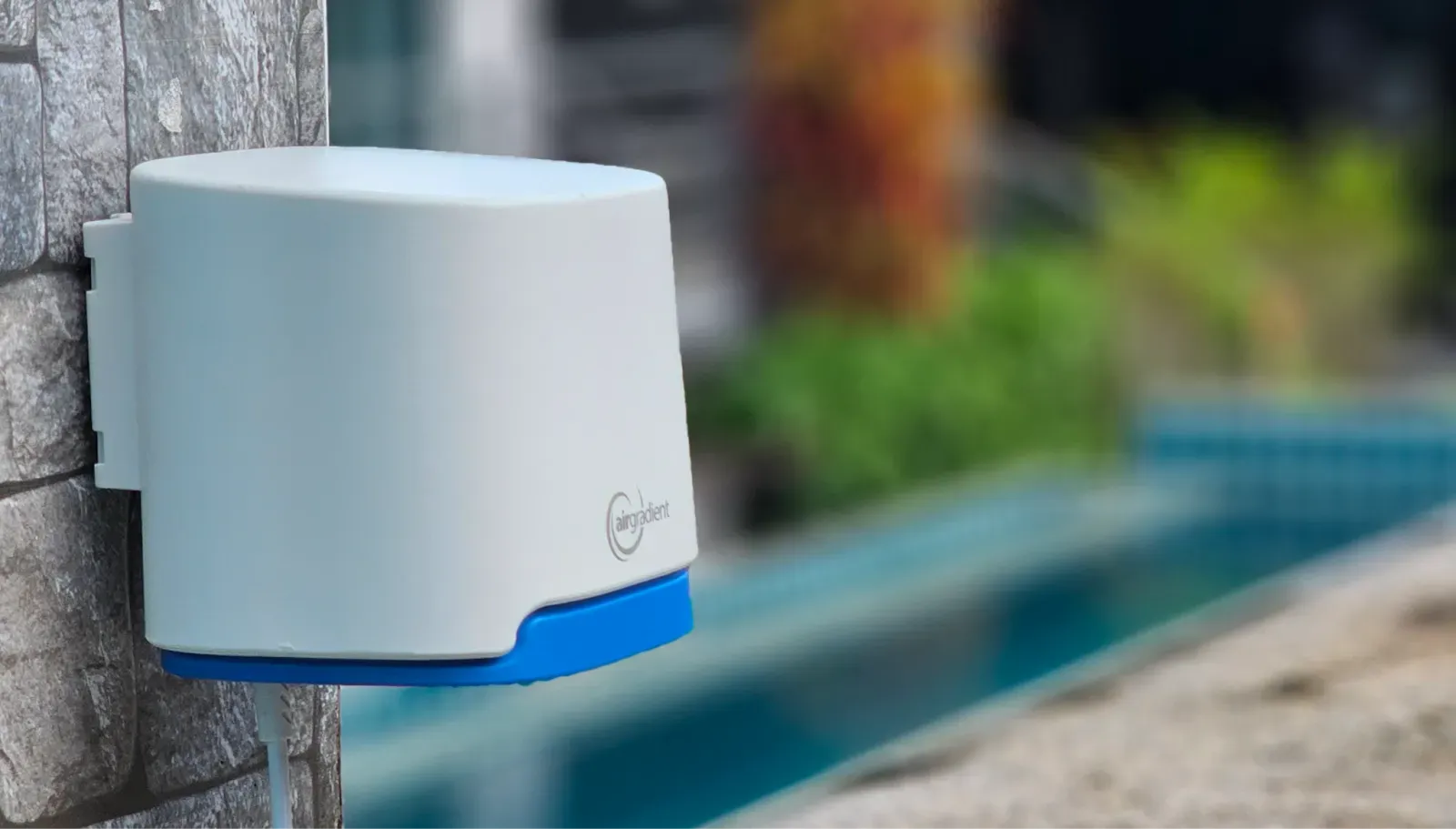 AirGradient Open Air monitor installed on a wall.