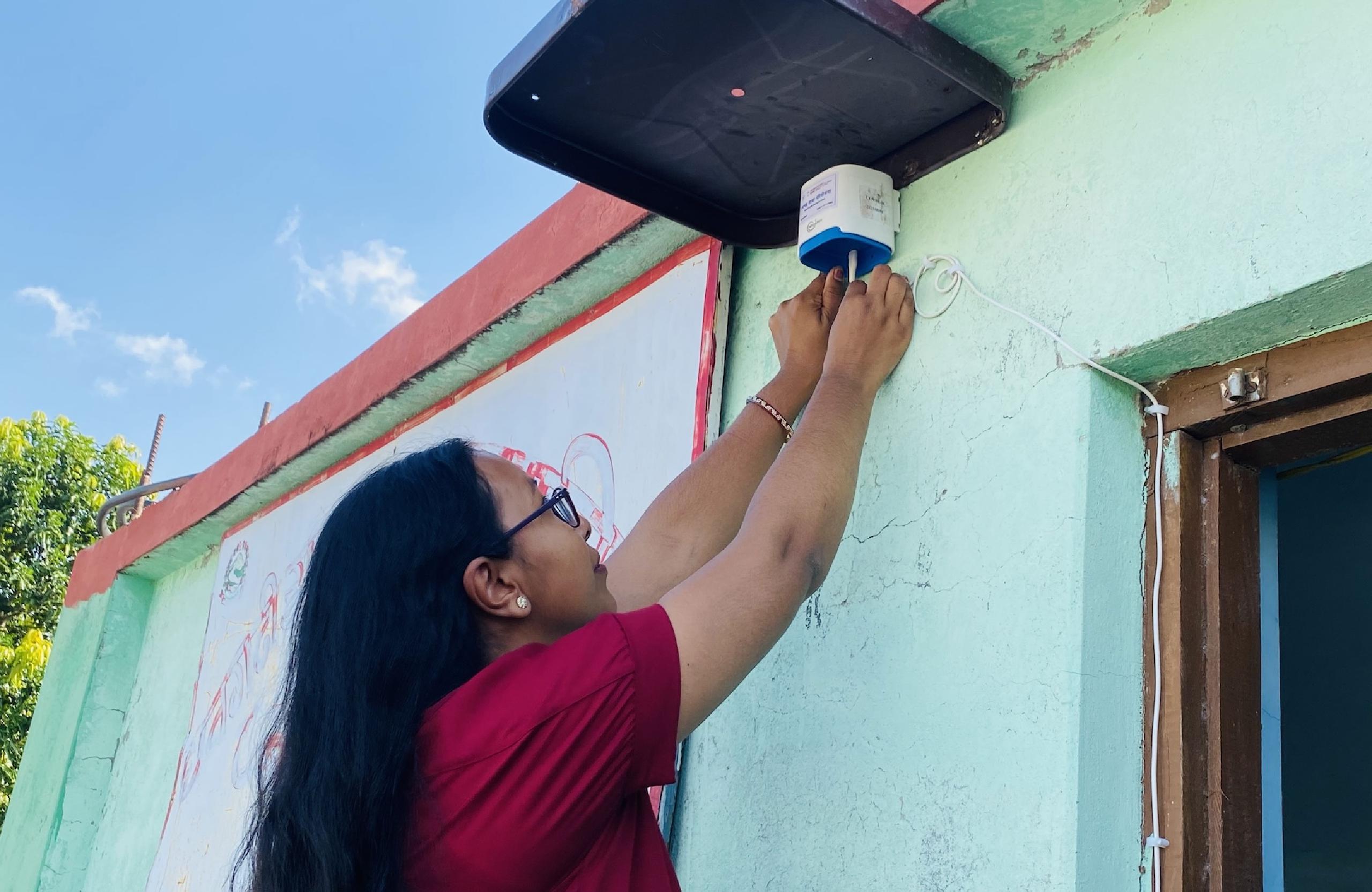 A sensor being installed in Dhangadhi Sub-Metropolitan City