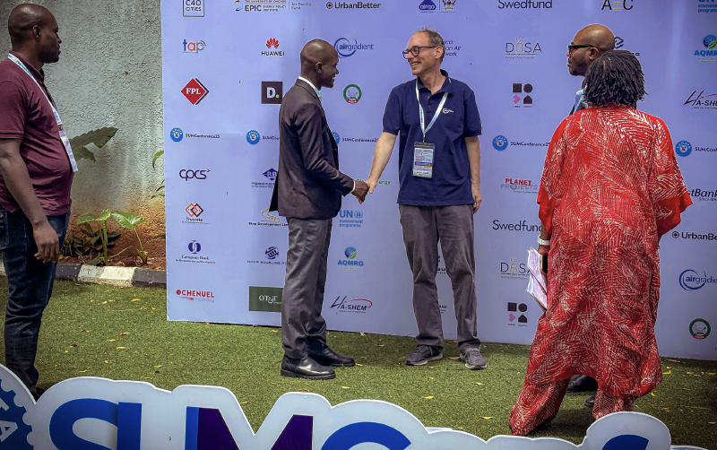 Achim and Oluwole Alfred shaking hands